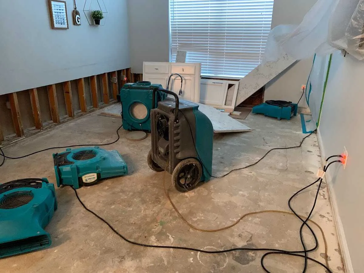 Dehumidifier in flood-cut room for Water Damage Restoration in Harvest
